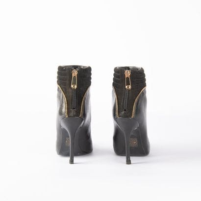 GUESS. Pair of black leather and black suede...