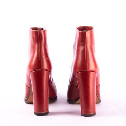 Lot of three pairs of shoes
PRADA. Red leather...