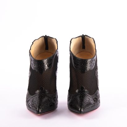 CHRISTIAN LOUBOUTIN. Pointed-toe black leather...