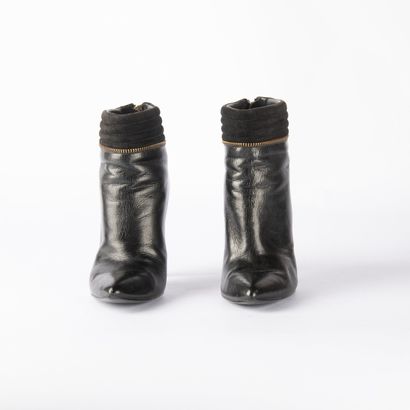 GUESS. Pair of black leather and black suede...