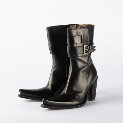 Four pairs of black heeled boots. 1/ CHARLES...