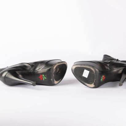 Four pairs of black heeled boots. 1/ CHARLES...