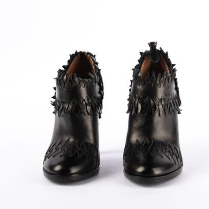 ALAÏA PARIS. Heeled boots with round toes...