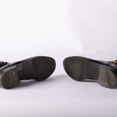 CHANEL. Pair of cavalier-style boots in black...