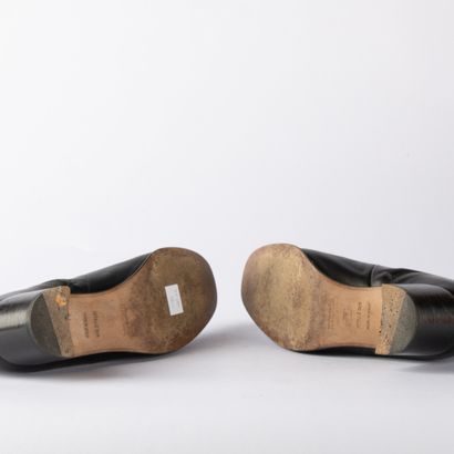 HERMÈS. Pair of black leather ankle boots...