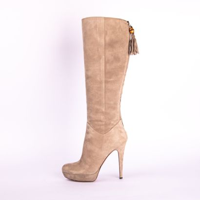 GUCCI. Heeled boots in gray suede calfskin,...