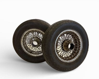 5 Jaguar spoke wheels, two with tires
Rim...