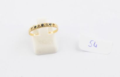 Bague en or jaune, pierres noires et blanches...