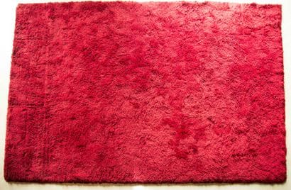 * TISCA
Grand tapis fait main en laine rouge,...