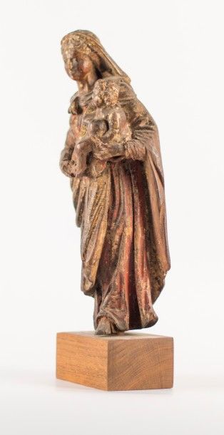 Vierge à l'enfant.
Sujet en bois sculpté,...