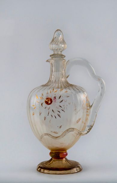 Emile GALLE (1846-1904). Carafe à côtes torses,...