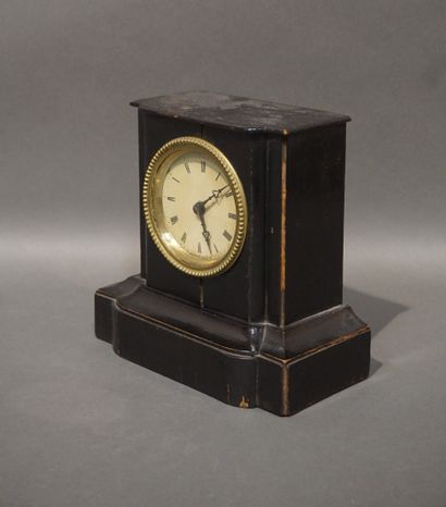 Small terminal clock in blackened wood (wear)....