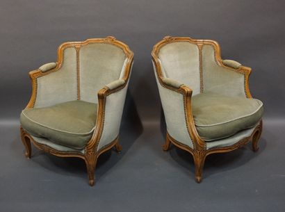 Pair of bergères in molded natural wood,...