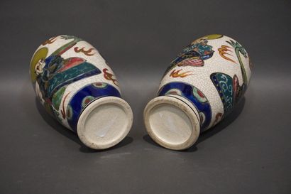 Pair of Asian earthenware vases with figures...