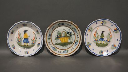 Three earthenware plates, two in Quimper...