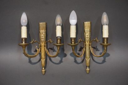 Pair of bronze sconces decorated with quivers....