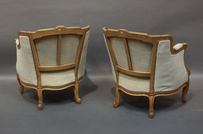 Pair of bergères in molded natural wood,...