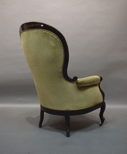 Blackened wood bergère upholstered in green...