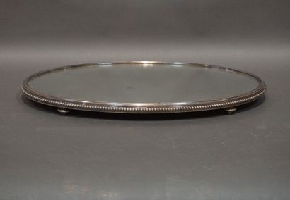 Mirror and silver-plated metal oval centerpiece...