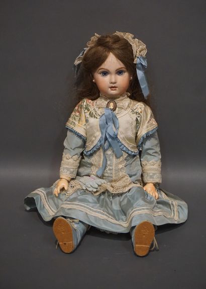 Doll with porcelain head and fixed eyes (one...