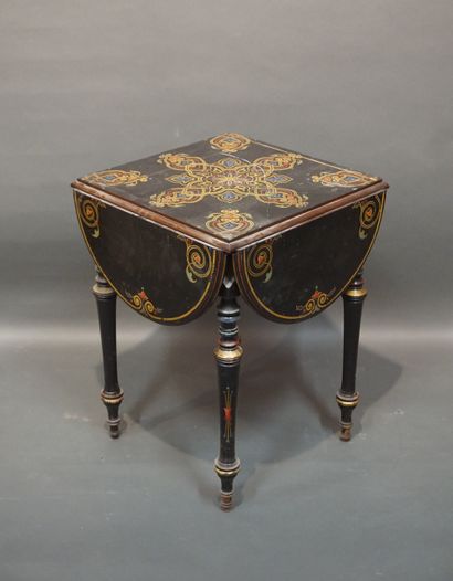 19th-century table in blackened wood, with...