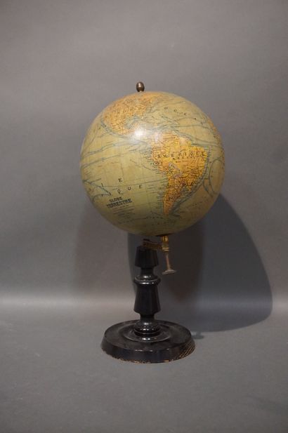 Globe on blackened wooden base, erected and...