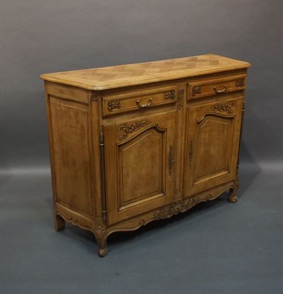 Moulded and carved natural wood sideboard...