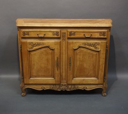 Moulded and carved natural wood sideboard...