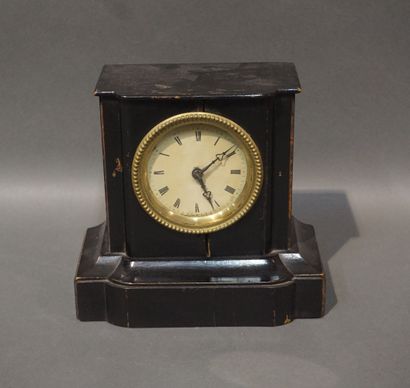 Small terminal clock in blackened wood (wear)....