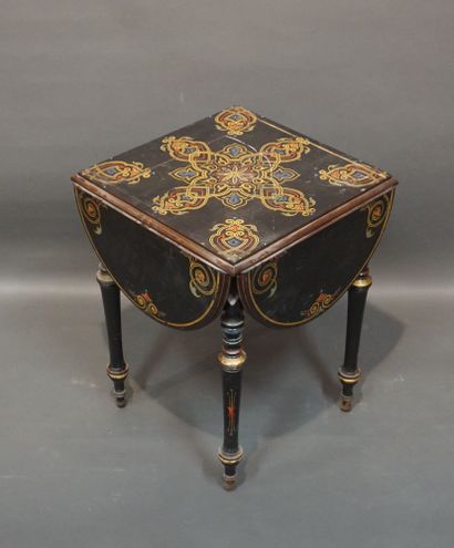19th-century table in blackened wood, with...