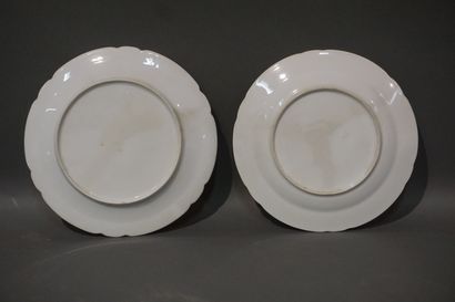 Two white porcelain plates decorated with...