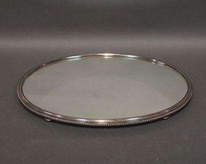 Mirror and silver-plated metal oval centerpiece...