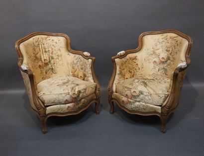 Pair of low bergères in molded natural wood,...