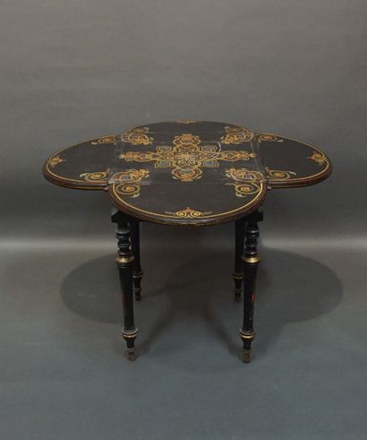 19th-century table in blackened wood, with...