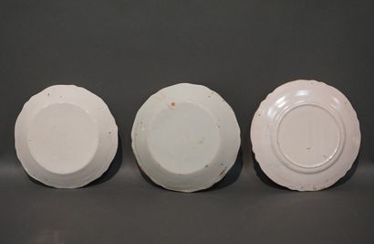 Three earthenware plates, two in Quimper...