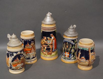 Cinq chopes en céramique à montures en métal....