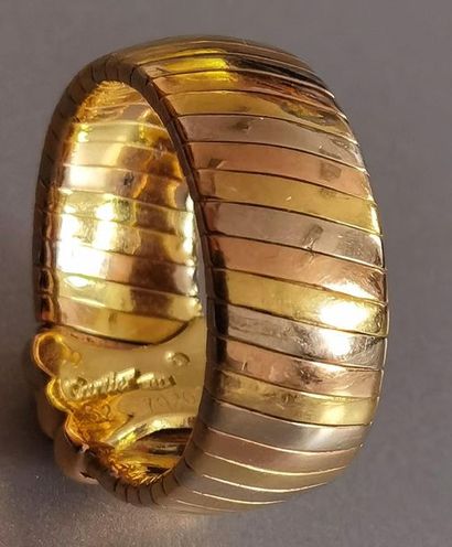 CARTIER. RING in 750 mm gold of three alternating...