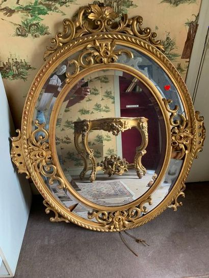 Oval mirror with gilded wood and stucco glazing...
