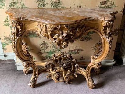 Curved gilded wood wall console on four feet...