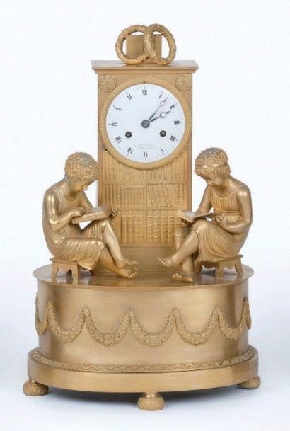 Pendule en bronze ciselé et doré, au thème...