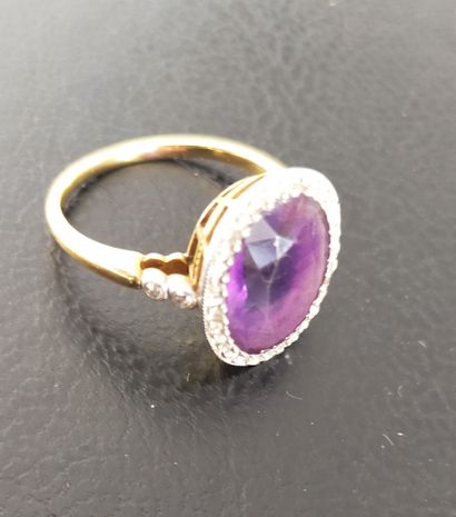 Bague en or 18k (750e) et platine, ornée...