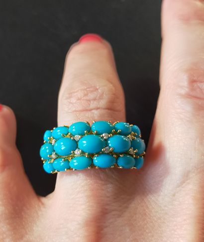 Bague en or jaune 18k (750e) serti de cabochons...