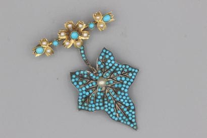 Barrette en or (9k) à motif de fleur sertie...