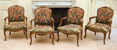 Suite de quatre fauteuils en bois naturel...