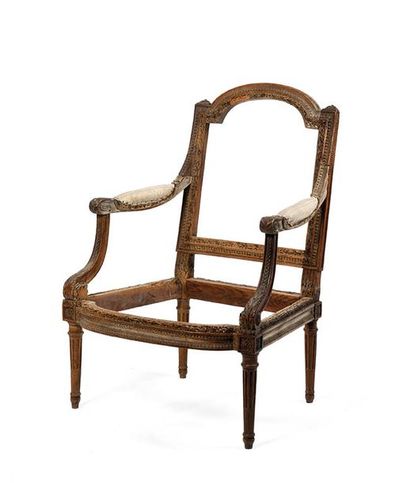 Fauteuil à dossier plat en bois sculpté à...