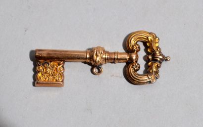 Small 18 K (750/oo) yellow gold KEY with...
