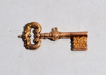 Small 18 K (750/oo) yellow gold KEY with...