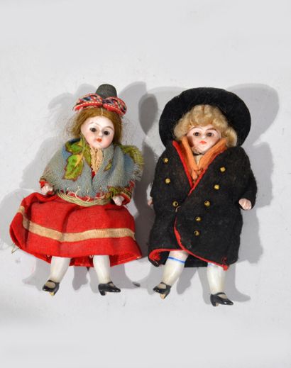 SMALL DOLLS entirely in porcelain, eyes in...