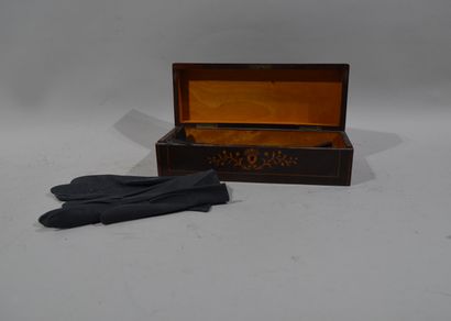 Small glove box inlaid with stylized foliage...