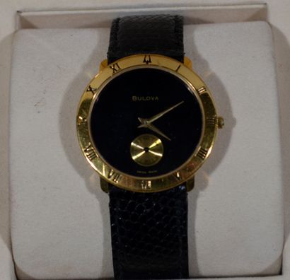 BULOVA

Gilt metal wristwatch with black...